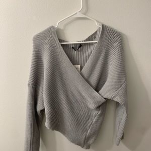 Cross body sweater